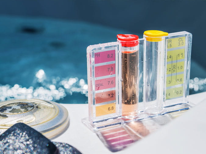 closeup of pool testing kit and chemicals