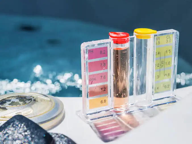 closeup of pool testing kit and chemicals